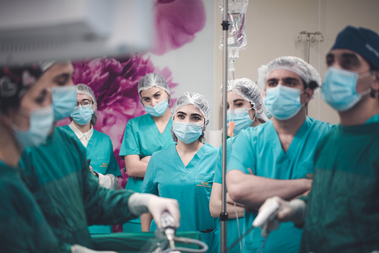 services-img Medical team in Baku operating room during laparoscopic procedure.