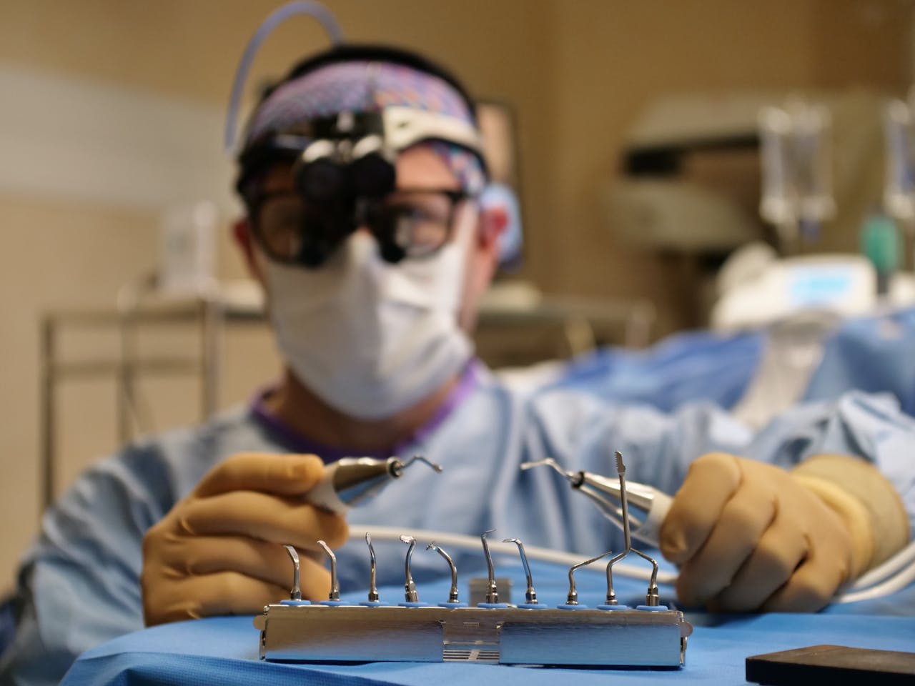 gallery-5 A focused surgeon in Paris prepares surgical instruments, emphasizing precision and care.